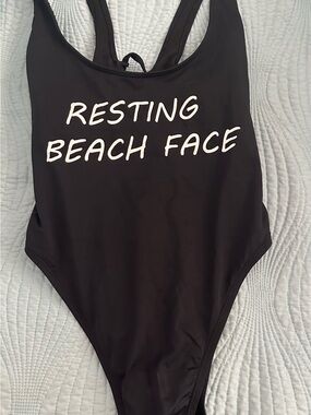 The Bikini Lab Black One-Piece Swimsuit with White 'Resting Beach Face' Print